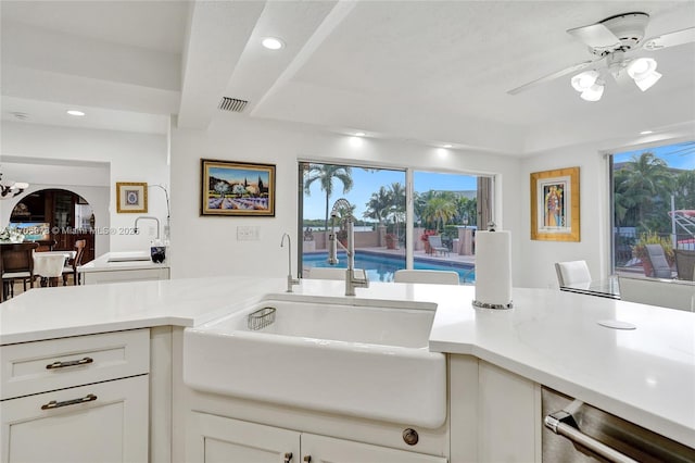 1960 NE 118th Rd, North Miami, FL 33181 - kitchen featuring a sink, stainless steel dishwasher, light countertops, ceiling fan, and healthy amount of natural light