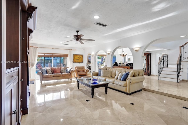 1960 NE 118th Rd, North Miami, FL 33181 - living area featuring arched walkways, a textured ceiling, a ceiling fan, stairs, and recessed lighting