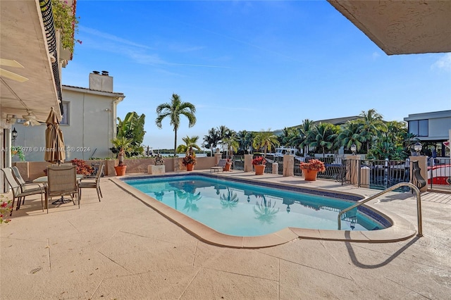 view of swimming pool featuring a patio area