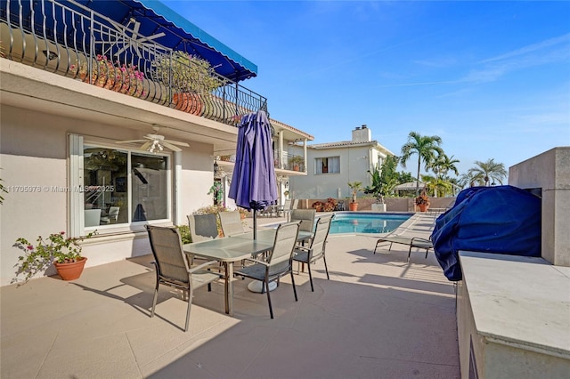 1960 NE 118th Rd, North Miami, FL 33181 - view of patio with ceiling fan, a balcony, and outdoor dining area