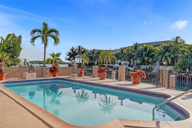 view of swimming pool with a patio