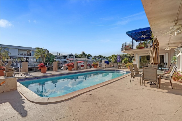 view of pool featuring a patio area and ceiling fan