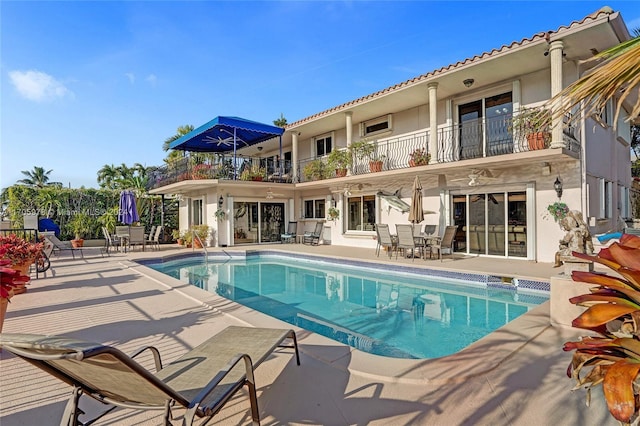 view of pool featuring a patio area