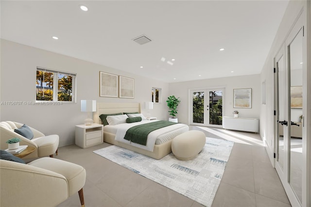 tiled bedroom featuring french doors