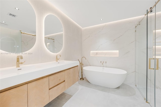 bathroom featuring vanity, separate shower and tub, and tile walls