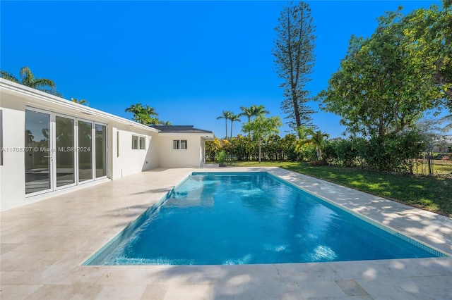 view of swimming pool with a patio