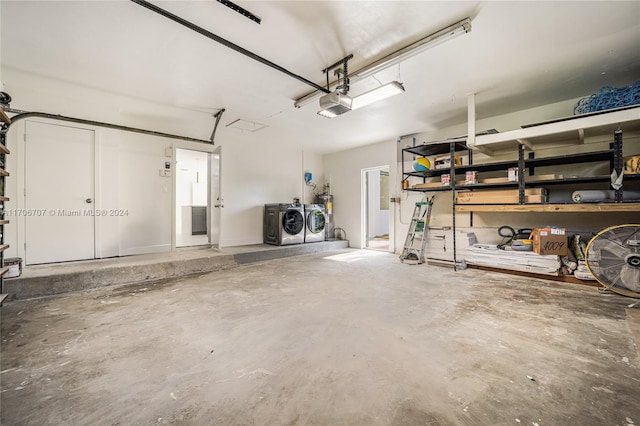 garage featuring washer and clothes dryer and a garage door opener