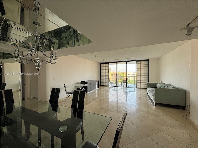 dining room featuring a chandelier and floor to ceiling windows