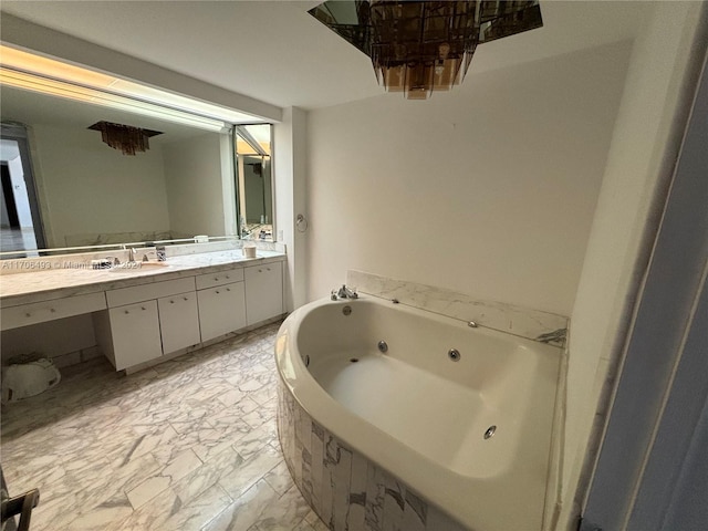 bathroom with vanity and tiled bath