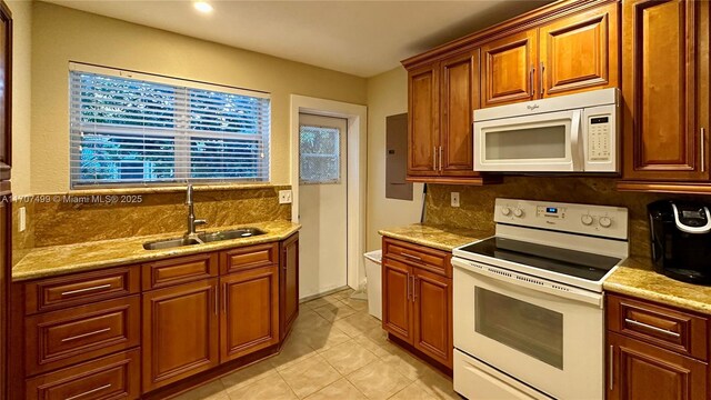 empty room with french doors, ceiling fan, ornamental molding, wood-type flooring, and built in shelves