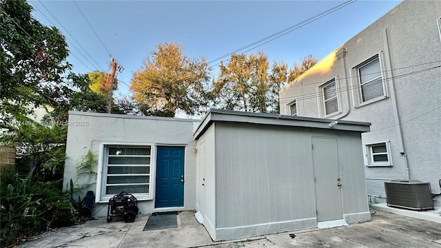 view of outbuilding with central air condition unit