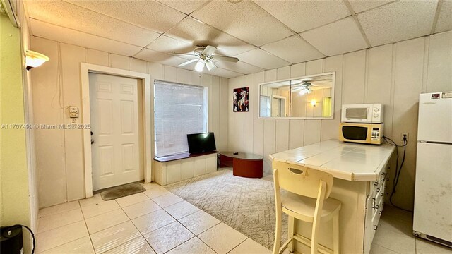 bathroom with vanity, toilet, tile patterned floors, and a shower with curtain