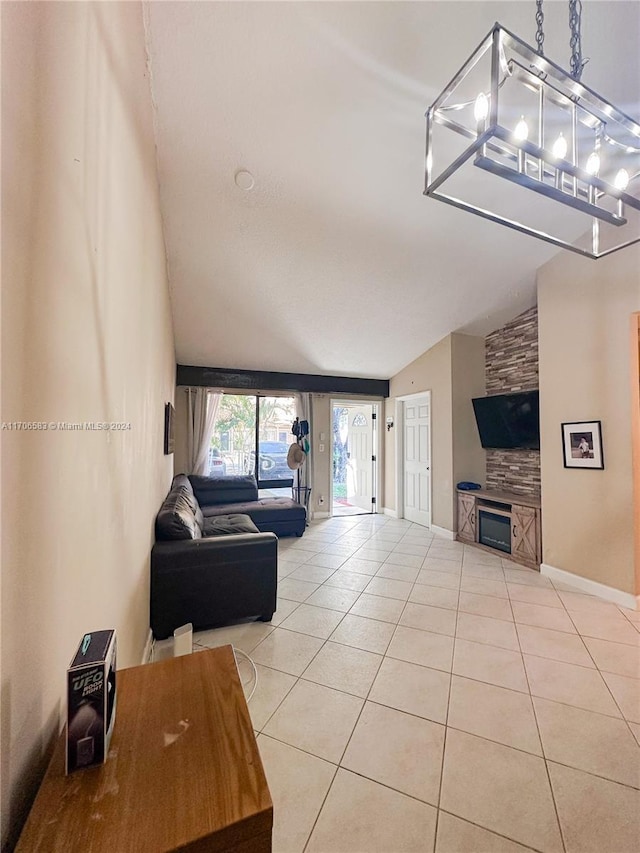 living room with light tile patterned floors and vaulted ceiling