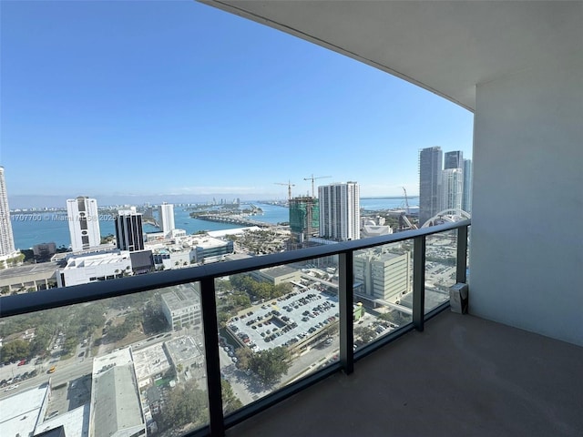 balcony featuring a water view