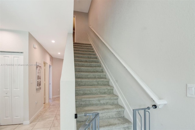 stairs with tile patterned flooring