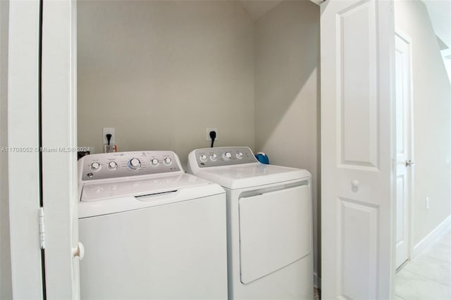 laundry area with separate washer and dryer