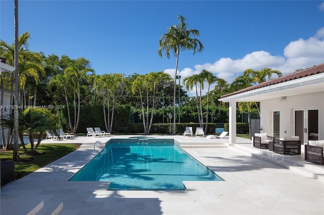 view of swimming pool with a patio area