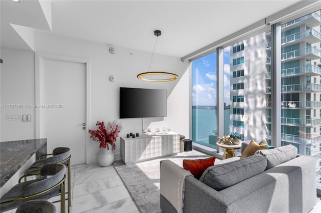 living room with expansive windows and a wealth of natural light