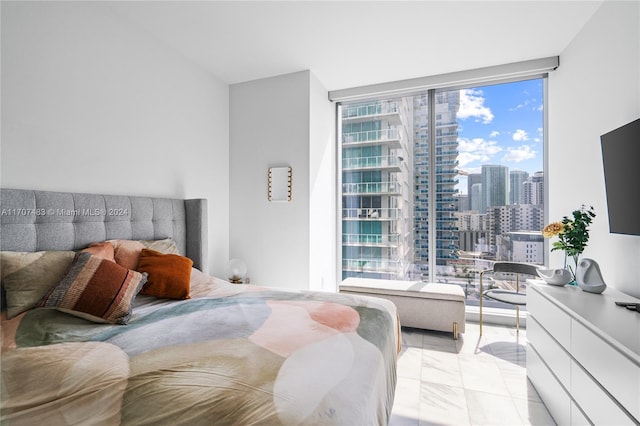 bedroom featuring floor to ceiling windows