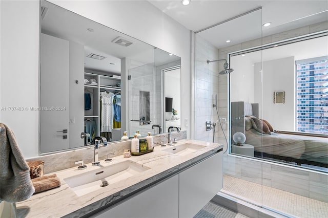 bathroom with vanity and a shower with shower door