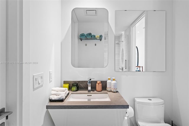 bathroom with vanity and toilet