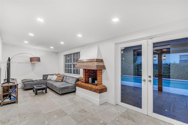 living room with a fireplace and french doors