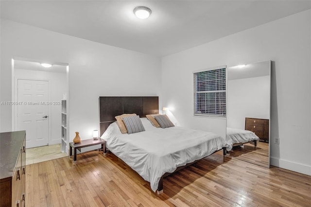 bedroom with light wood-type flooring