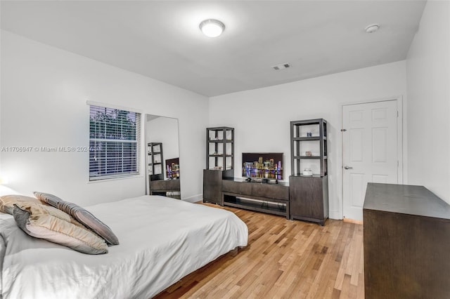 bedroom with light hardwood / wood-style floors