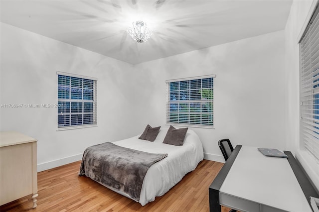 bedroom with wood-type flooring