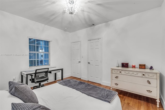 bedroom featuring wood-type flooring