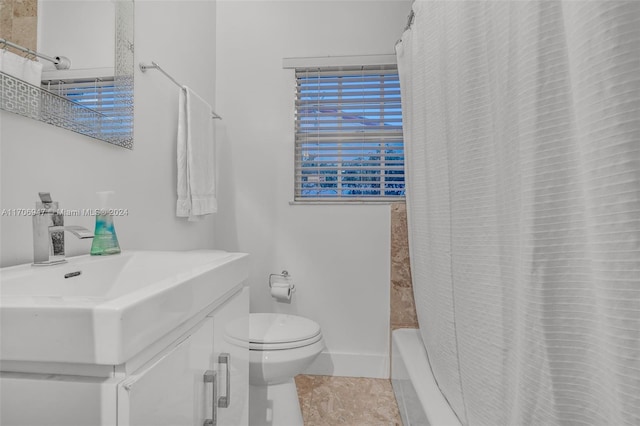 bathroom featuring tile patterned floors, vanity, and toilet