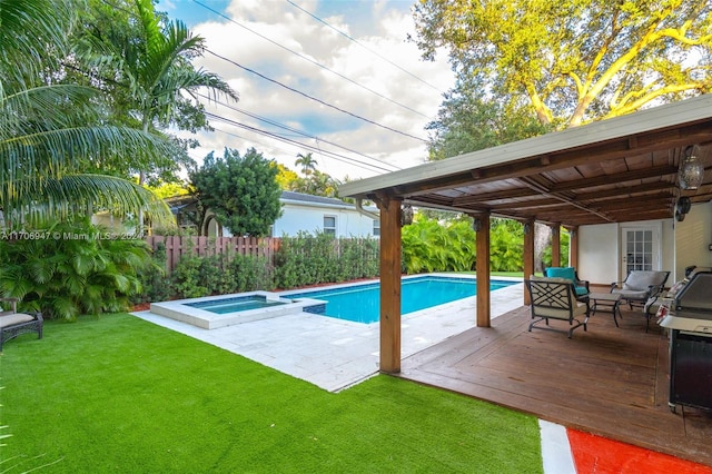 view of swimming pool with a wooden deck, an in ground hot tub, a yard, and an outdoor hangout area