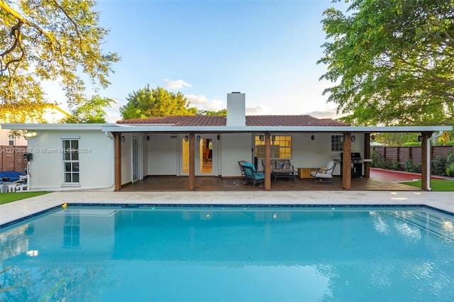 rear view of property featuring a patio area