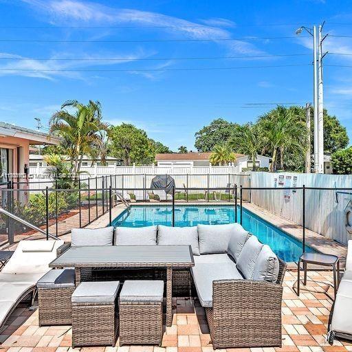 view of swimming pool with a patio area