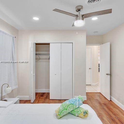 bedroom featuring ceiling fan and light hardwood / wood-style floors