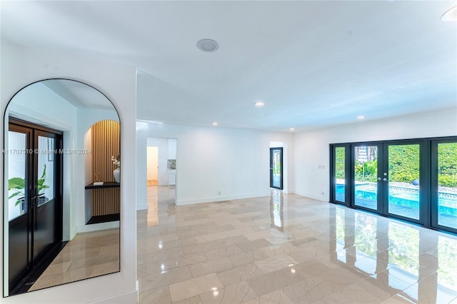 spare room featuring french doors