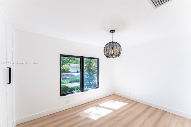 spare room featuring light hardwood / wood-style floors