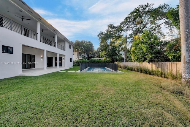 6401 SW 84th St, South Miami, FL 33143 - view of yard featuring ceiling fan, a balcony, and a patio area