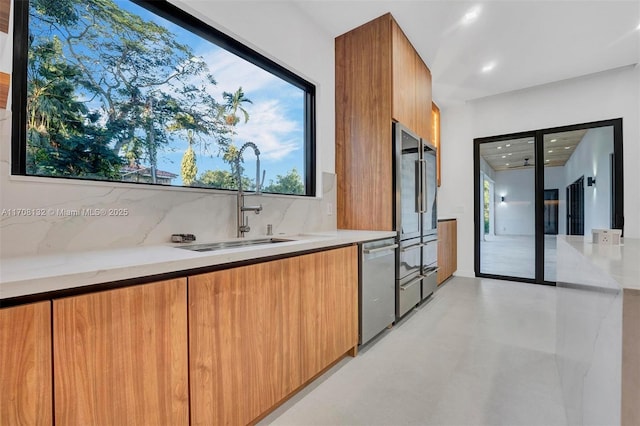 6401 SW 84th St, South Miami, FL 33143 - kitchen featuring modern cabinets, stainless steel appliances, decorative backsplash, brown cabinetry, and recessed lighting