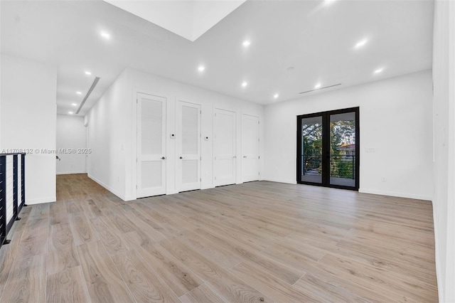 6401 SW 84th St, South Miami, FL 33143 - unfurnished living room featuring light wood-type flooring and recessed lighting