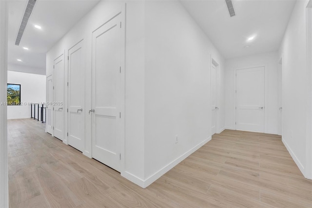 6401 SW 84th St, South Miami, FL 33143 - hallway featuring light wood-style flooring and recessed lighting