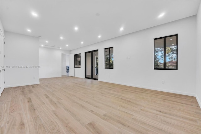 6401 SW 84th St, South Miami, FL 33143 - empty room with light wood finished floors, plenty of natural light, and recessed lighting