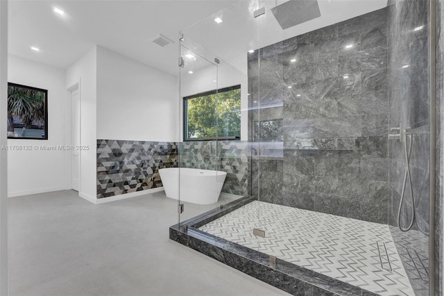 6401 SW 84th St, South Miami, FL 33143 - full bathroom with a marble finish shower, a soaking tub, tile walls, and concrete floors