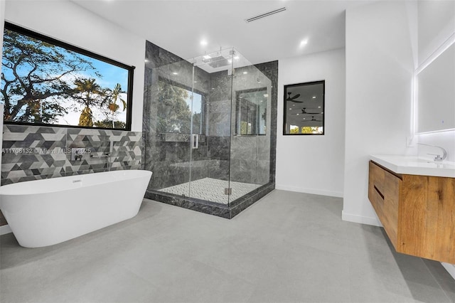 6401 SW 84th St, South Miami, FL 33143 - bathroom with a freestanding bath, a stall shower, vanity, recessed lighting, and concrete floors