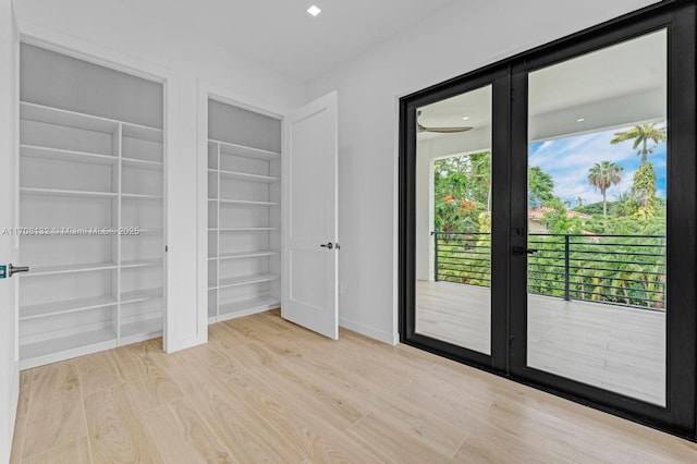 6401 SW 84th St, South Miami, FL 33143 - unfurnished bedroom with access to outside, wood finished floors, and french doors