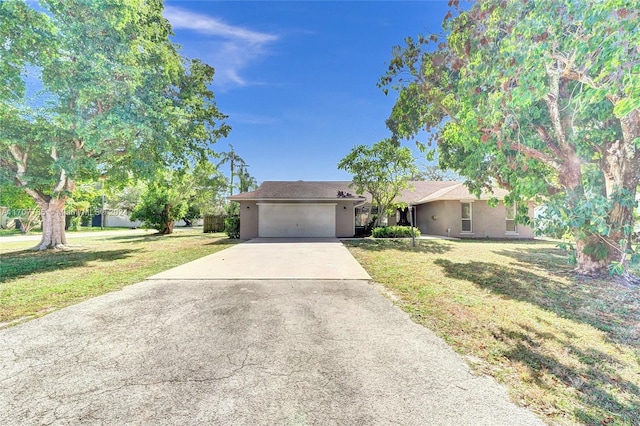 ranch-style house with a garage and a front yard