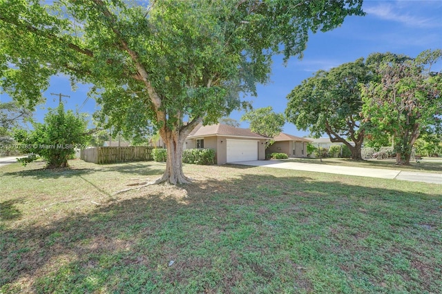 view of front of home featuring a garage and a front lawn