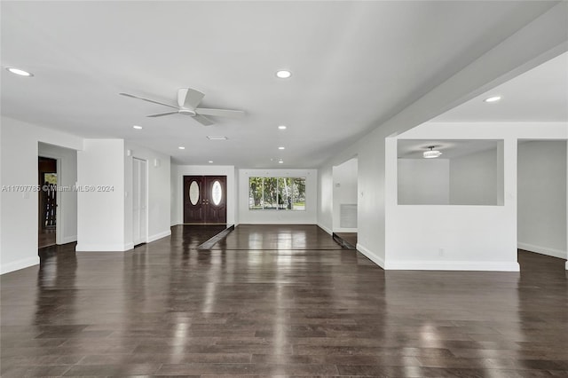 interior space featuring ceiling fan and dark hardwood / wood-style floors