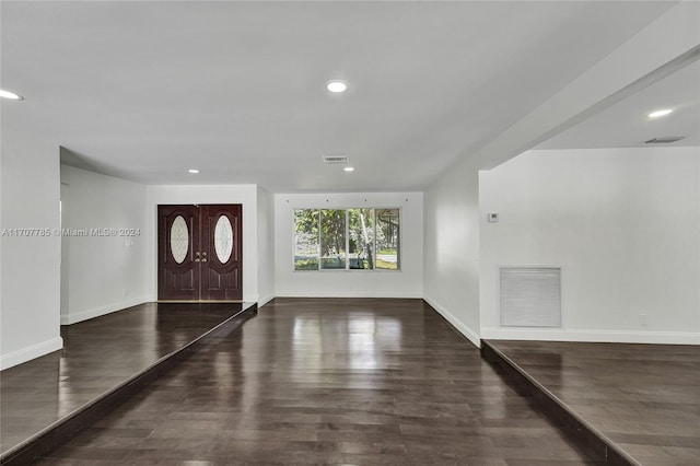 entrance foyer featuring dark hardwood / wood-style flooring