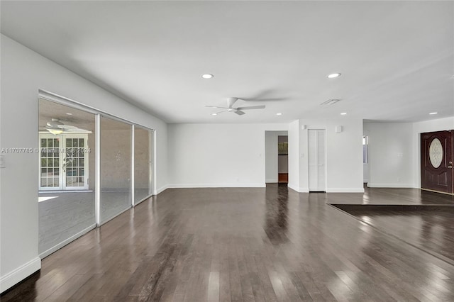 unfurnished living room featuring dark hardwood / wood-style flooring